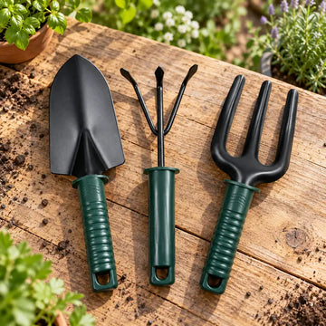 3-piece gardening tool set with green handles on a wooden table