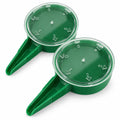 Pair of green adjustable seed dispensers for sowing small seeds